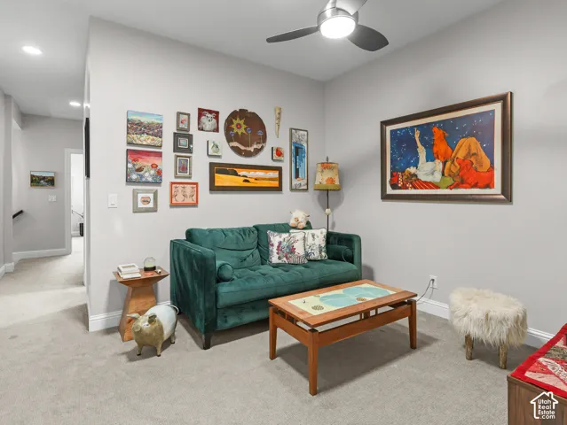 Recessed lighting, light gray wall paint, and ceiling fan with integrated lighting