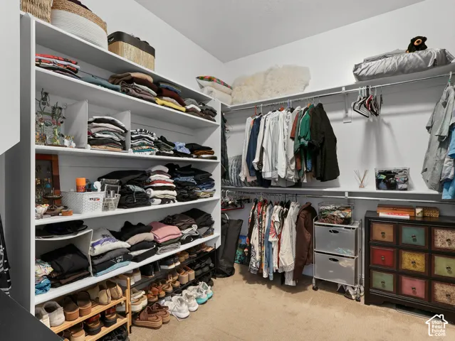 Built-in closet system featuring multiple shelves and hanging rods