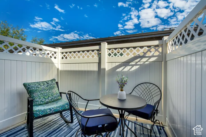 Private outdoor patio with privacy fencing and decorative lattice accents