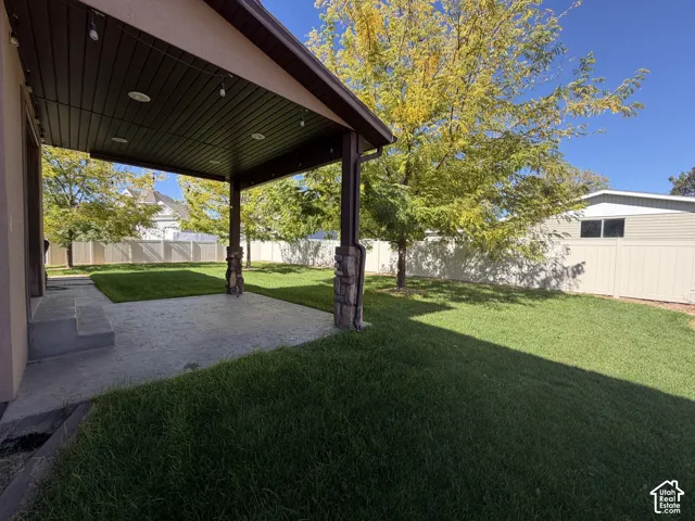 Covered patio with recessed lighting, string lights, and stamped concrete flooring