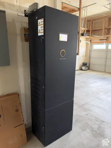 Wall-mounted Sonnen energy storage system featuring a matte black enclosure and digital interface