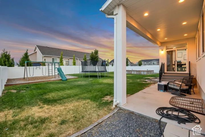 Covered patio with recessed lighting, concrete flooring, and direct access to the backyard