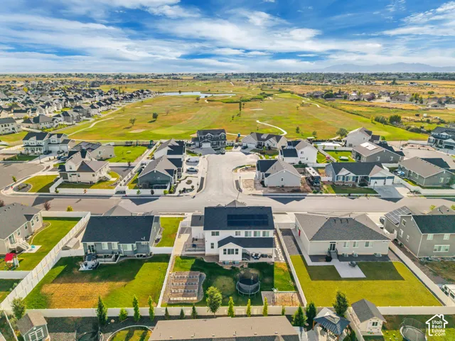 Expansive residential community featuring a golf course and surrounding mountain range