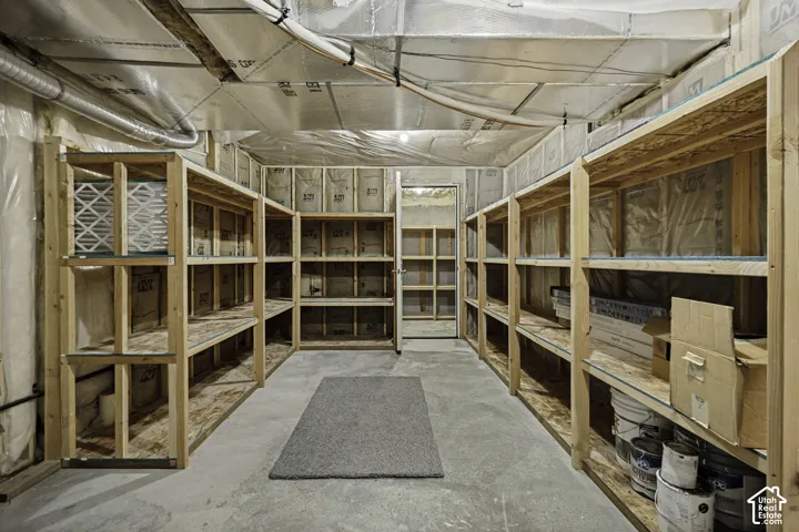 Concrete flooring with extensive built-in wooden shelving