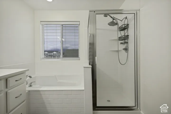 Tiled bathtub surround, built-in bathtub, and enclosed shower with clear glass door