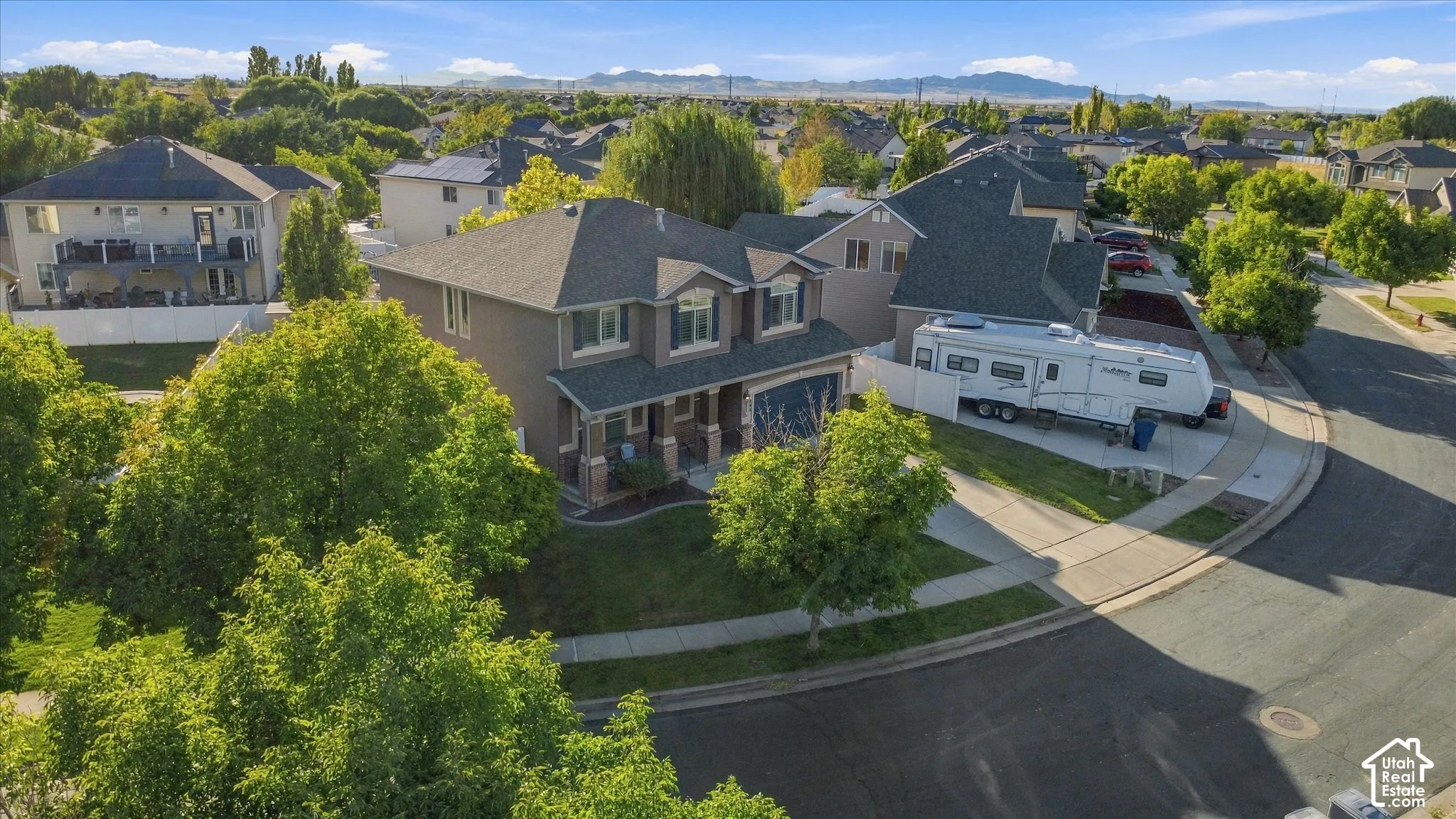 Two-story residence with a covered front porch and dormer windows
