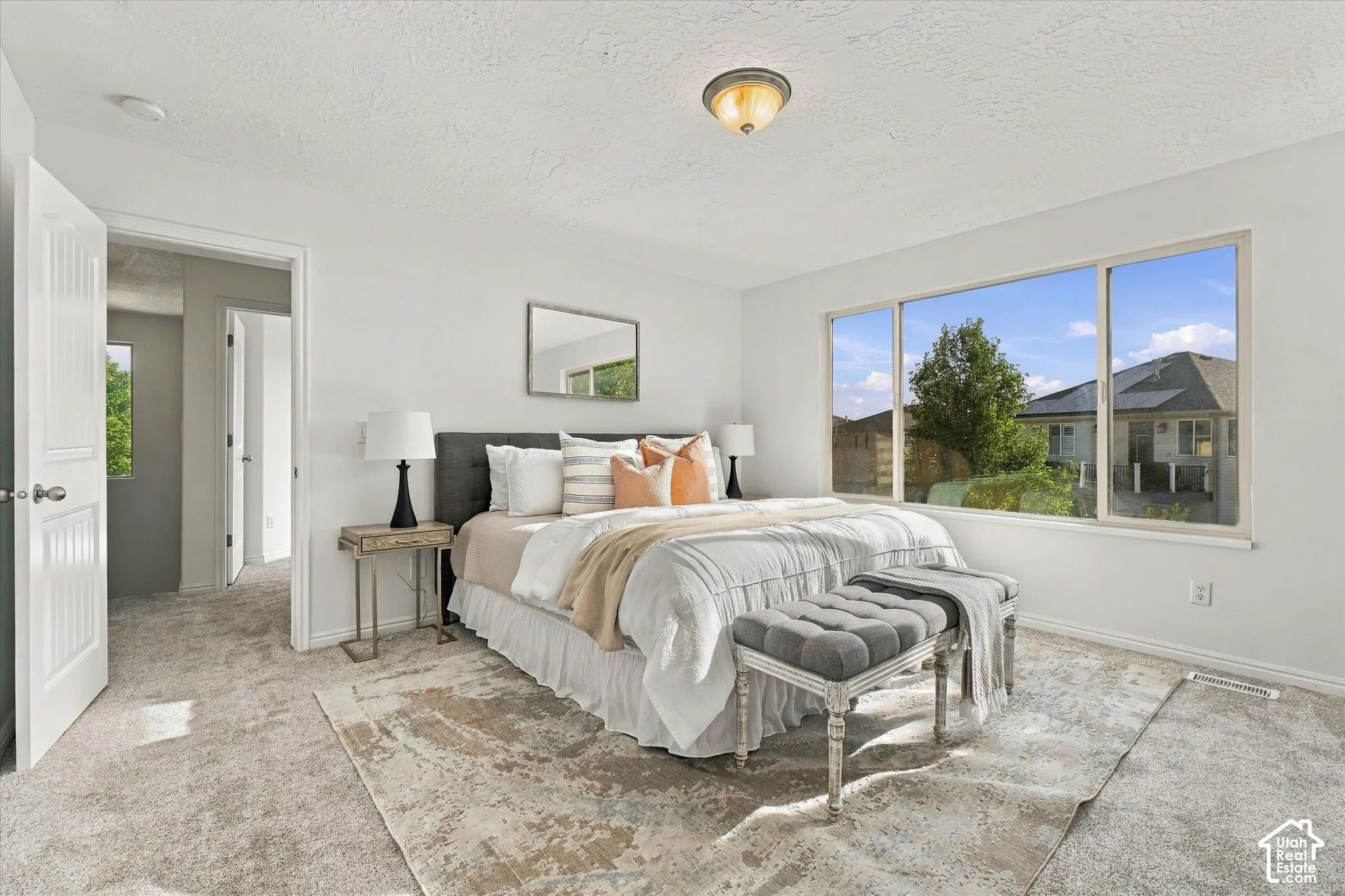 Wall-to-wall carpeting with a light neutral tone