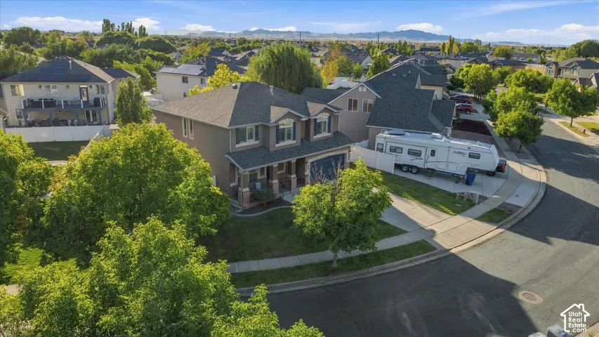 Two-story residence with a covered front porch and dormer windows