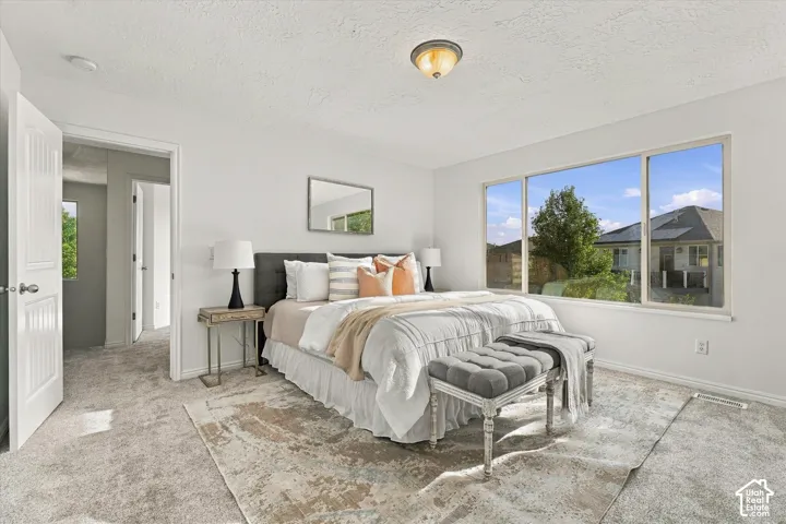 Wall-to-wall carpeting with a light neutral tone
