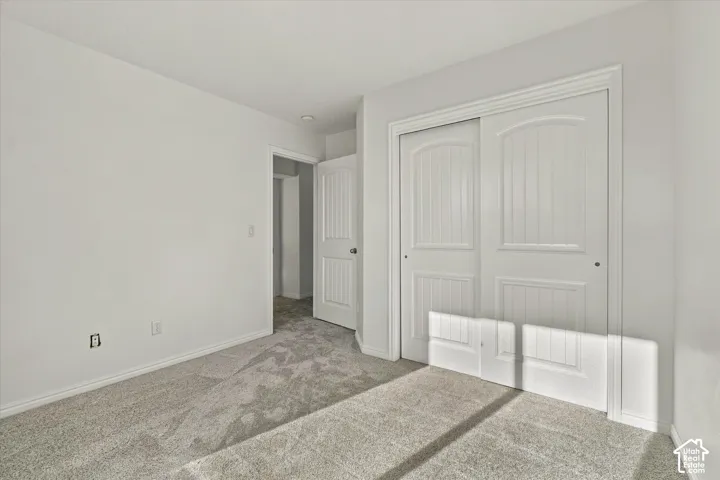 Neutral-toned carpeting paired with white walls