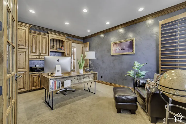 Built-in wood cabinetry with a granite countertop, recessed lighting, and wood-finish crown molding