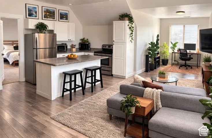ADU Full kitchen with stainless steel appliances and granite-finish countertops