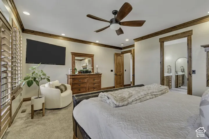 Recessed lighting, ceiling fan with wood-finish blades, plantation shutters, wood-trim doorway, and wood-finish door