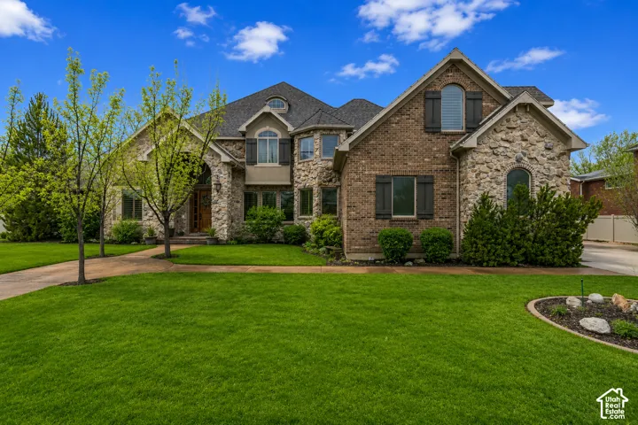 Stone and brick facade with dark shutters
