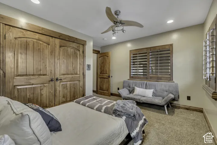 Recessed lighting, ceiling fan with integrated lighting, wood-finish bi-fold closet doors, wood-finish interior door, and plantation shutters