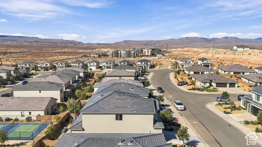Residential neighborhood featuring varied single-family homes, paved roads, and landscaped desert-style yards