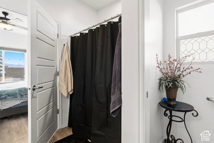 Recessed lighting, wood-finish flooring, and white paneled doors