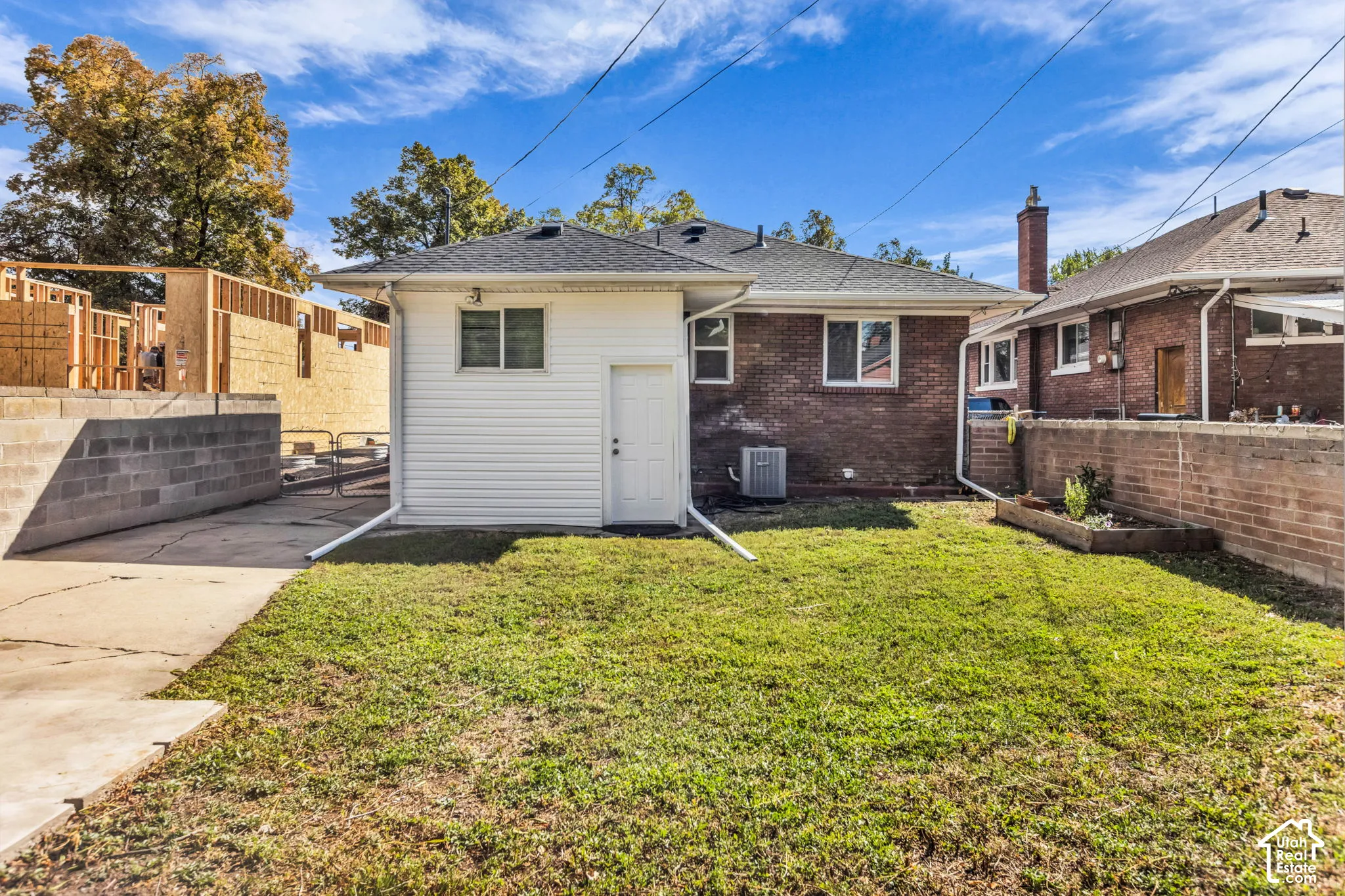 Fenced backyard with mature lawn