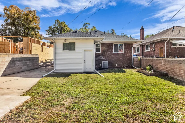 Fenced backyard with mature lawn