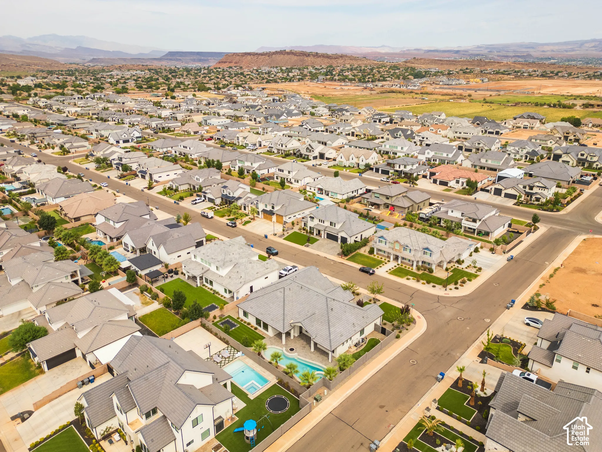 Residential neighborhood featuring detached homes, paved streets, and varied landscaping