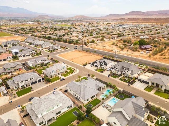 Established residential neighborhood featuring a variety of architectural styles, paved roadways, and integrated landscaping