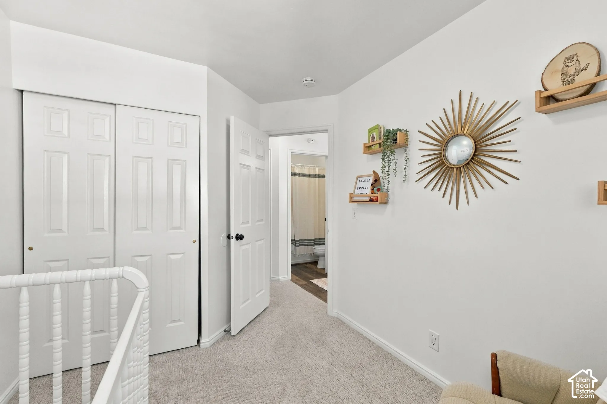 Second bedroom with natural light and neutral colors