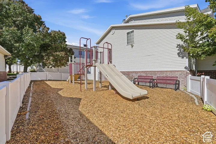 Playground area featuring a slide and climbing structure