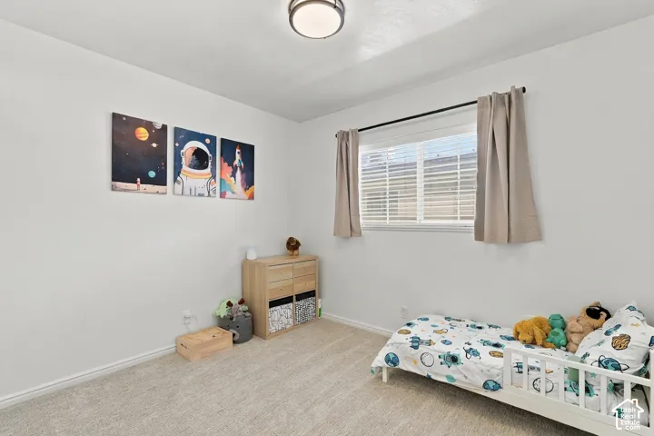 Third bedroom with natural light and neutral colors