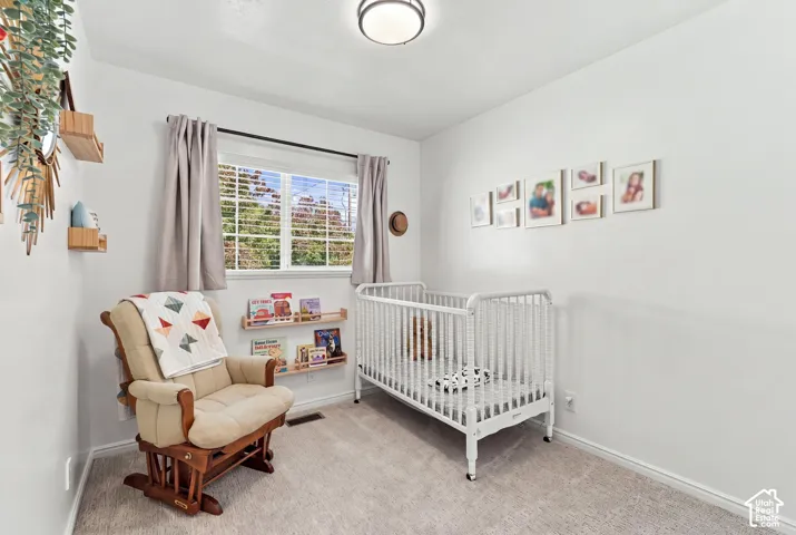 Second bedroom with natural light and neutral colors