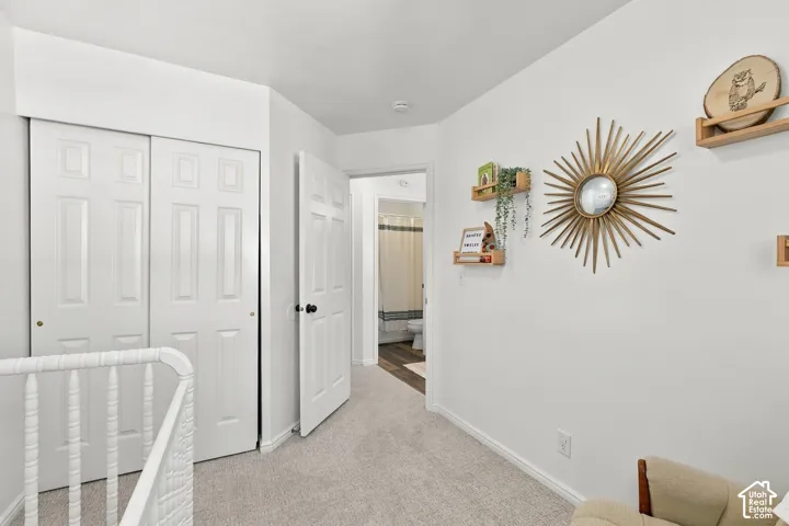 Second bedroom with natural light and neutral colors