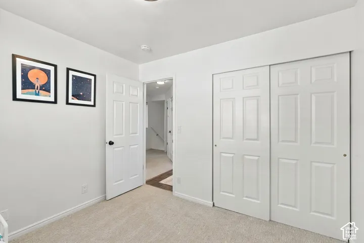 Third bedroom with natural light and neutral colors