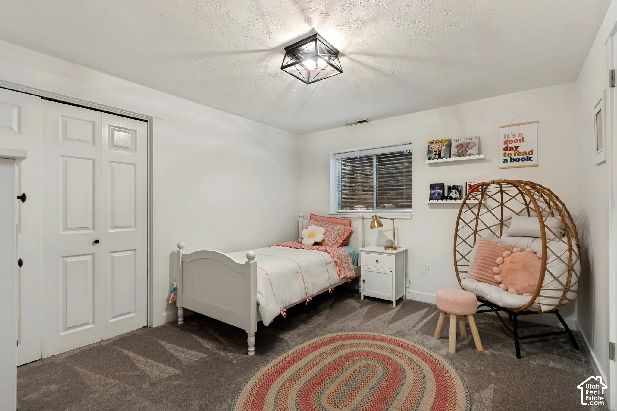 Recessed window with horizontal blinds, overhead flush mount lighting, and white walls