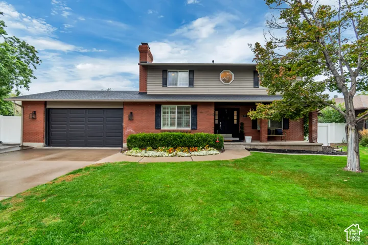 Brick and siding exterior with a two-car garage