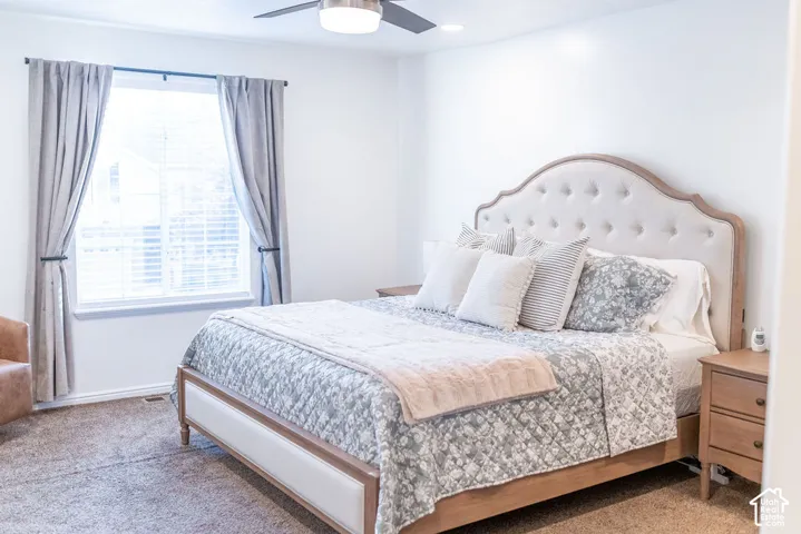 Recessed lighting, ceiling fan, window with blinds, and neutral wall color