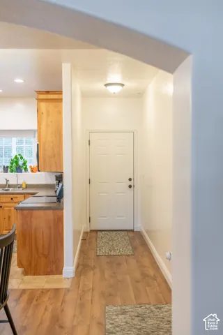 Entryway with wood-finish flooring and a flush-mount ceiling light