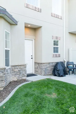 Stucco exterior with stone veneer accents
