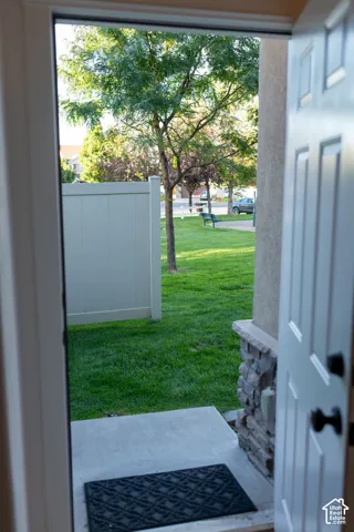 Concrete entryway with a stone veneer accent