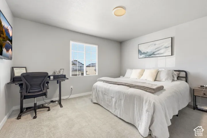 Window with white blinds, neutral wall paint, and overhead flush-mount lighting