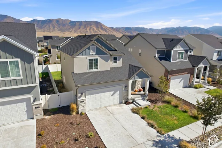 Contemporary exterior with mixed siding and stone accents