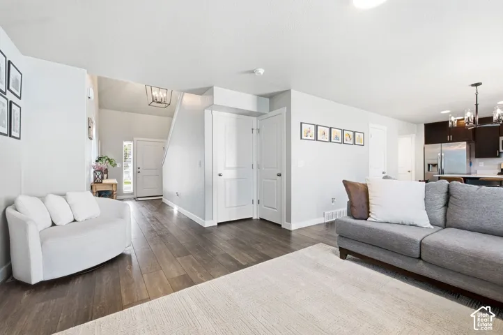 Wood-finish flooring, white trim, and light gray walls