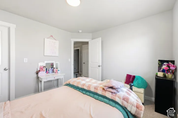 Light gray painted walls with white trim and carpeting