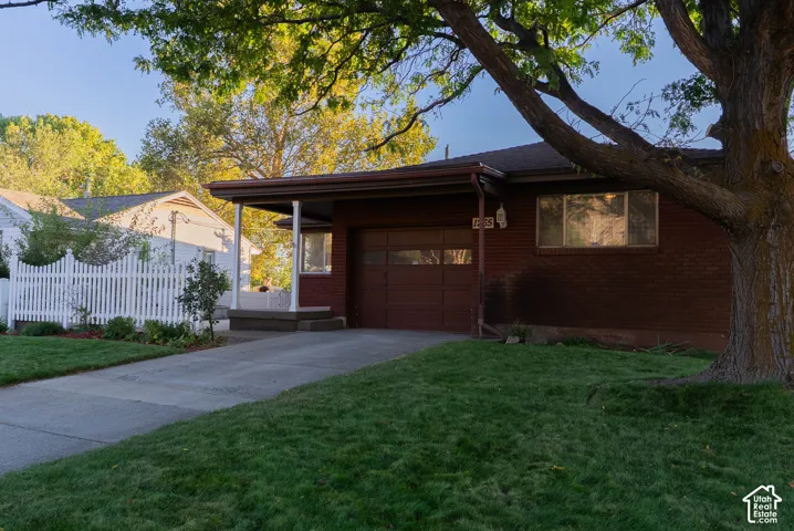 Brick exterior with attached carport and garage