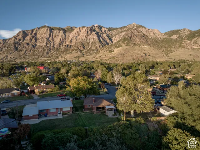 Expansive mountain backdrop with a residential neighborhood
