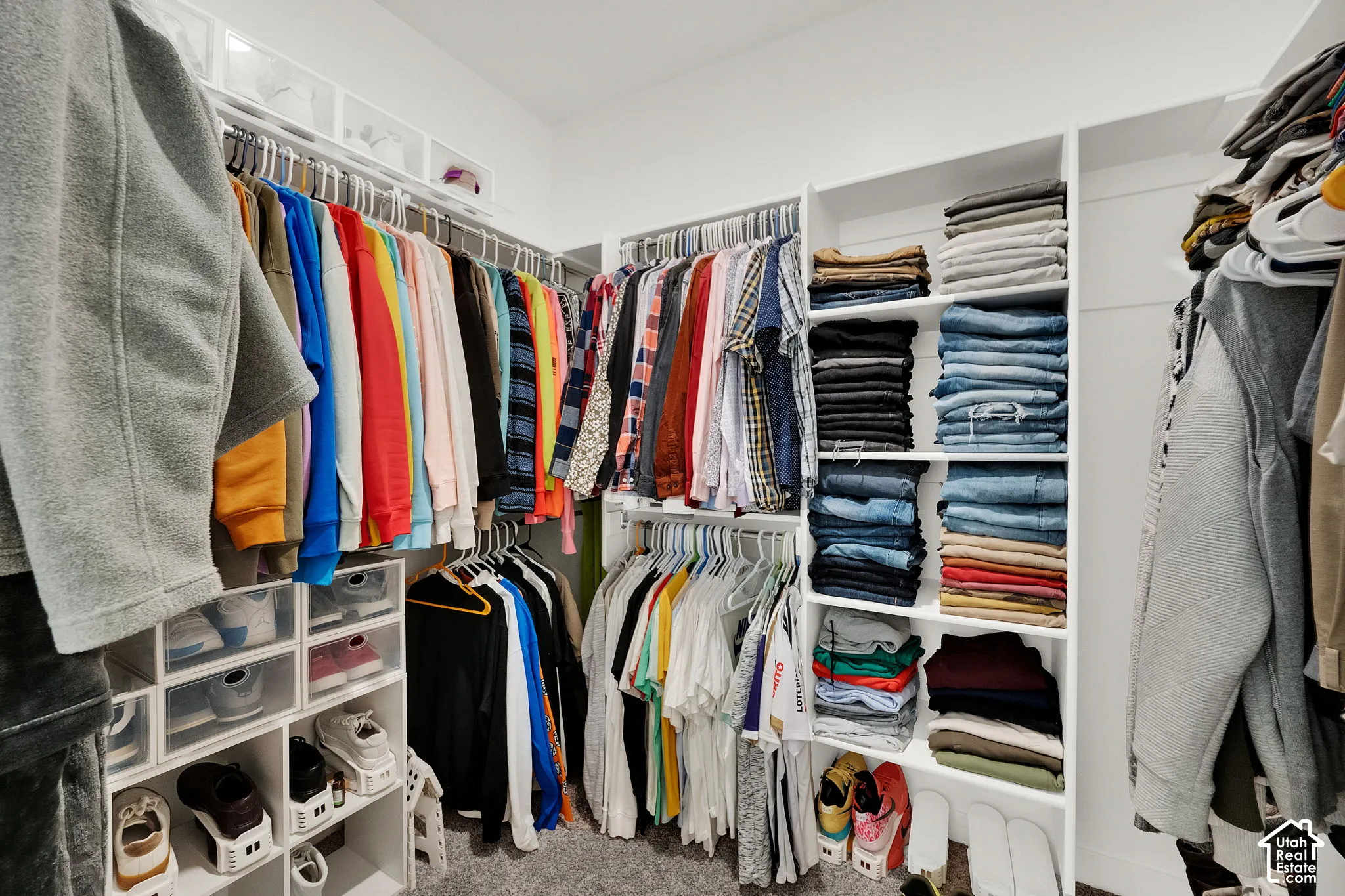 Custom closet system featuring built-in shelving, hanging rods, and integrated shoe storage