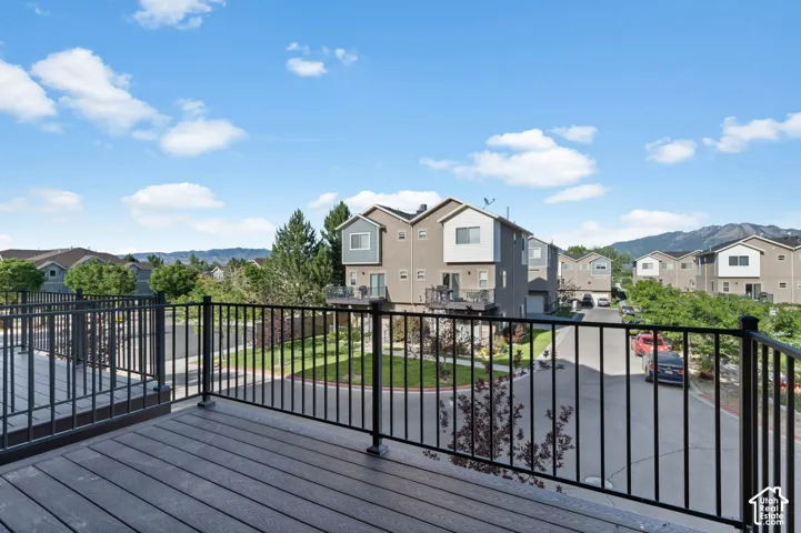 Expansive outdoor deck with black metal railings