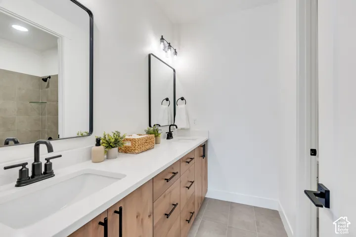 Dual sink vanity with wood-finish cabinetry and quartz countertops