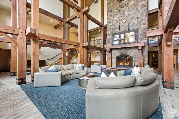 Stone-clad fireplace feature with a wood mantel
