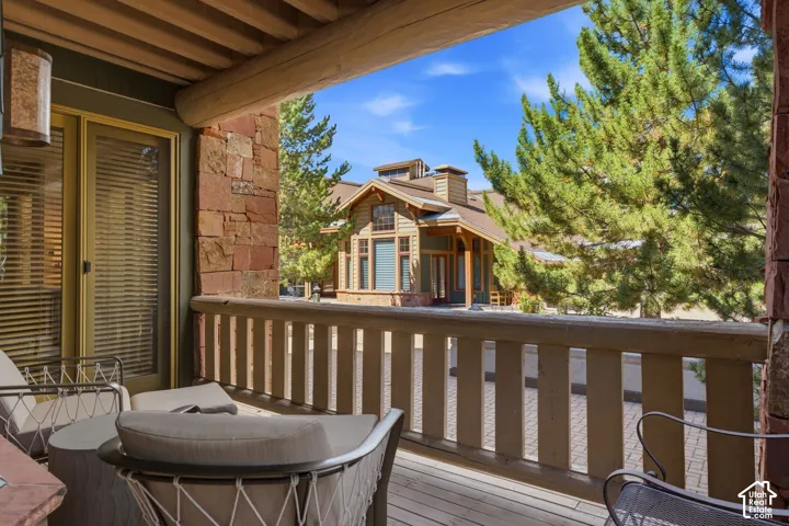 Deck with wood plank flooring and wood railing