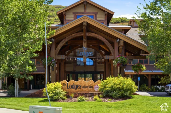 Multi-story building with a prominent timber-frame entry