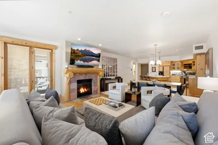 Stone-faced fireplace with a log mantel